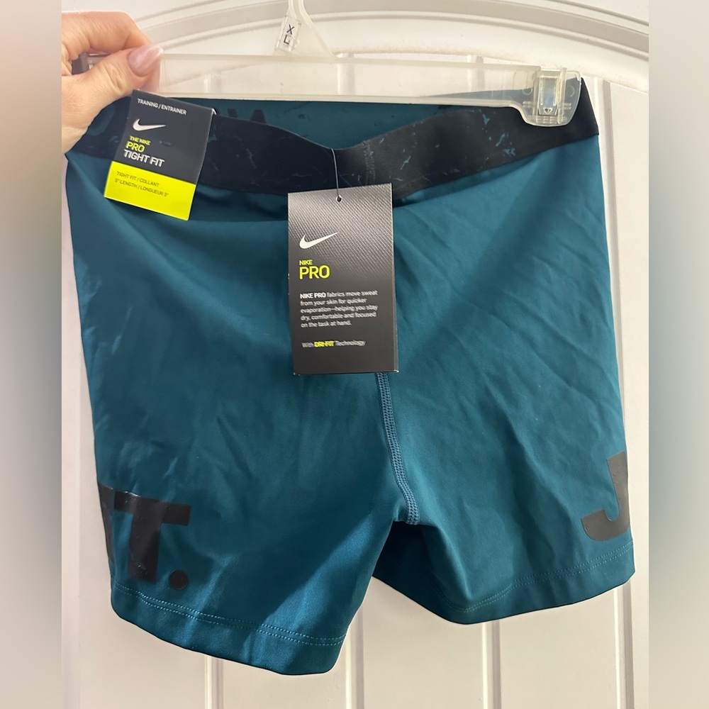 Teal blue Nike Pro shorts with tags